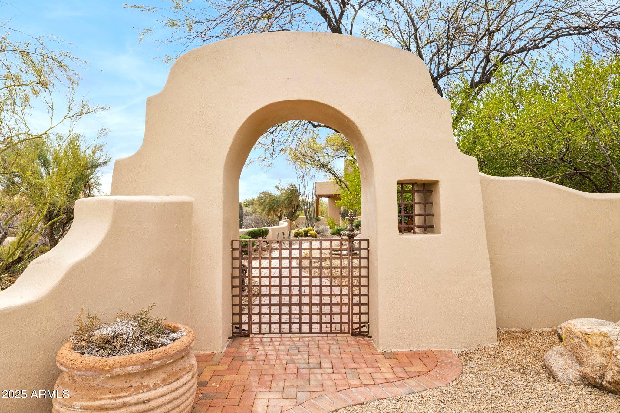 30600 North Pima Road, Unit 38 Scottsdale, AZ 85266 - Photo 4 of 49 a view of a bedroom with a bed and the potted plant