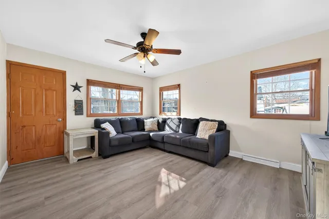 a living room with furniture and a large window