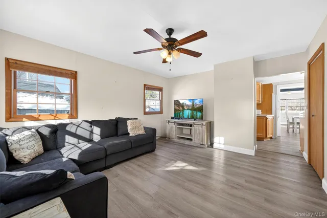 a living room with furniture and a window