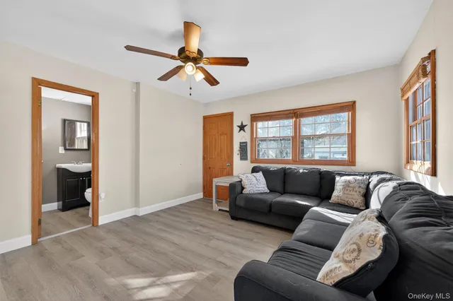 a living room with furniture and a window