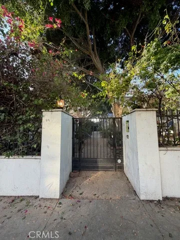 a view of patio with plants and trees