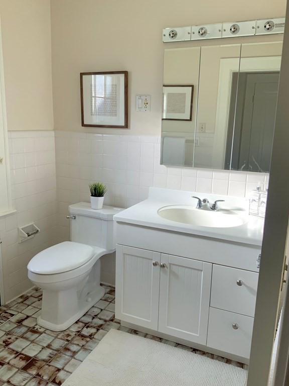 31 Grandview Road Arlington, MA 02476 - Photo 13 of 22 a bathroom with a sink toilet and mirror