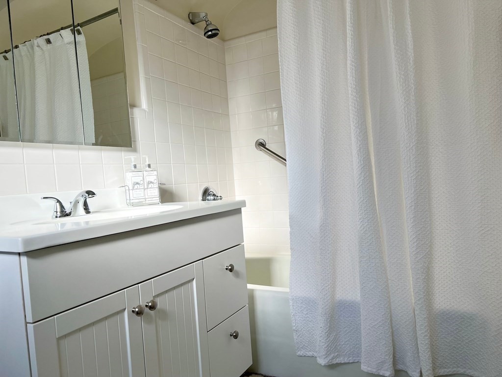 31 Grandview Road Arlington, MA 02476 - Photo 14 of 22 a bathroom with a sink and a mirror