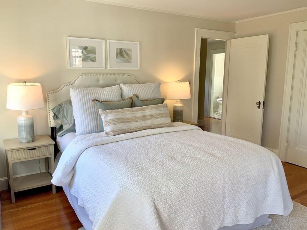 31 Grandview Road Arlington, MA 02476 - Photo 15 of 22 a bedroom with a bed and a night stand