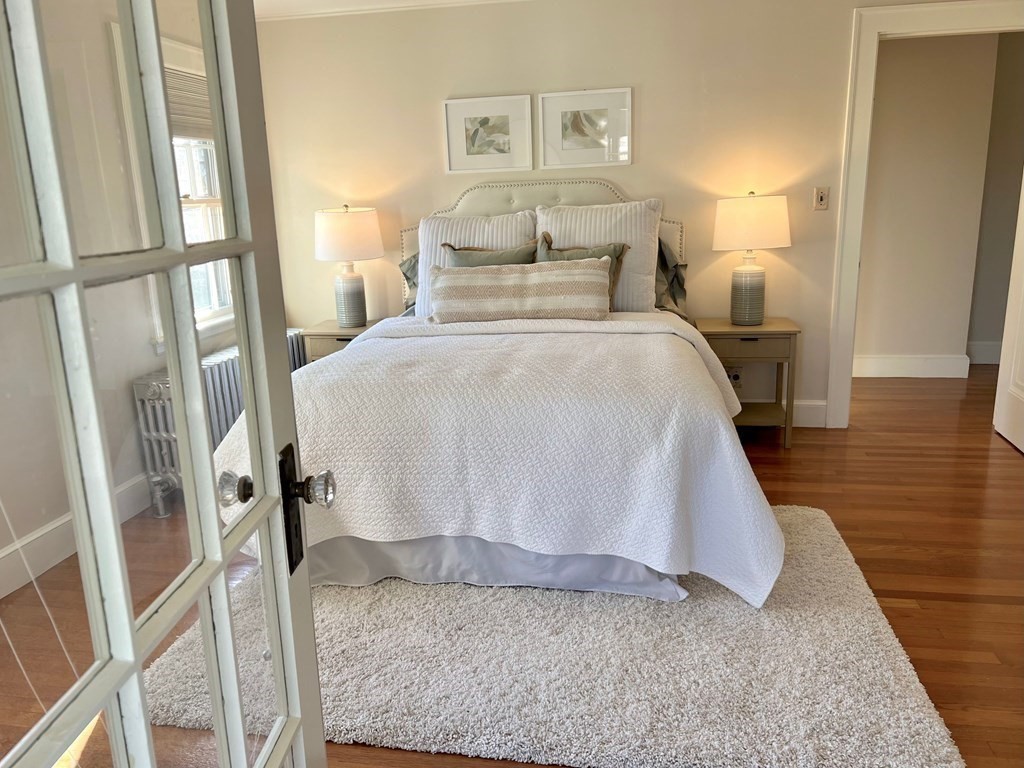 31 Grandview Road Arlington, MA 02476 - Photo 16 of 22 a bed sitting in a bedroom next to a window