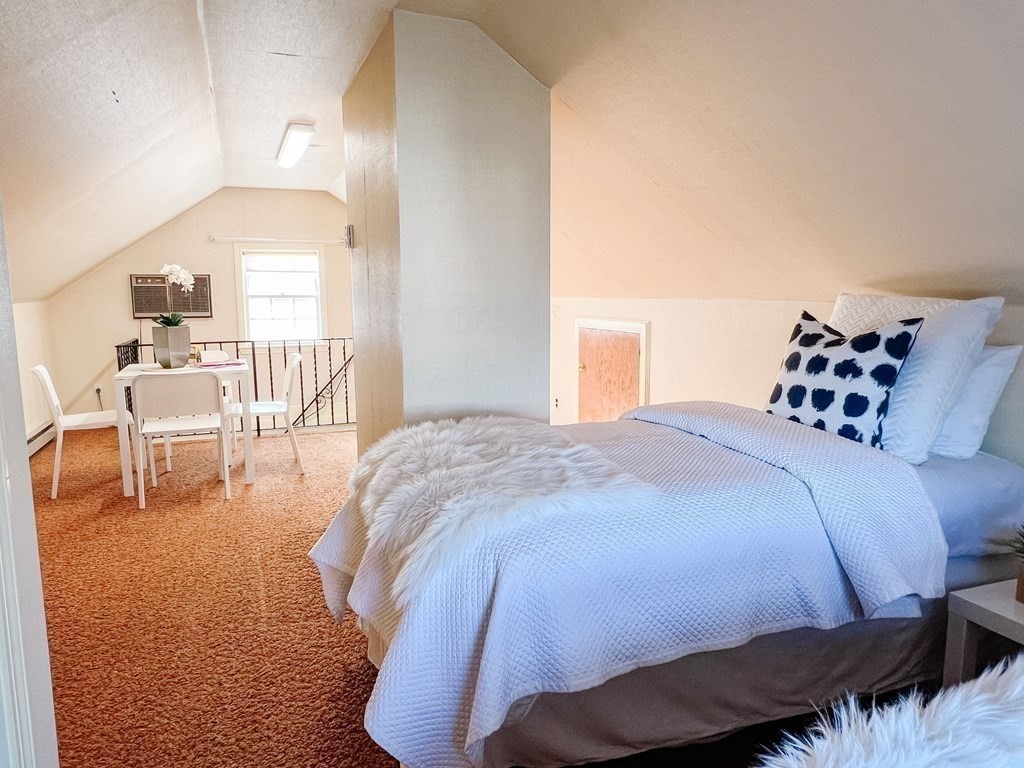31 Grandview Road Arlington, MA 02476 - Photo 20 of 22 a bed sitting in a bedroom next to a larger window