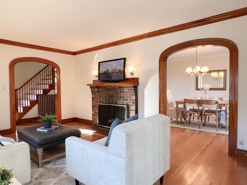 31 Grandview Road Arlington, MA 02476 - Photo 6 of 22 a living room with furniture a fireplace and a flat screen tv