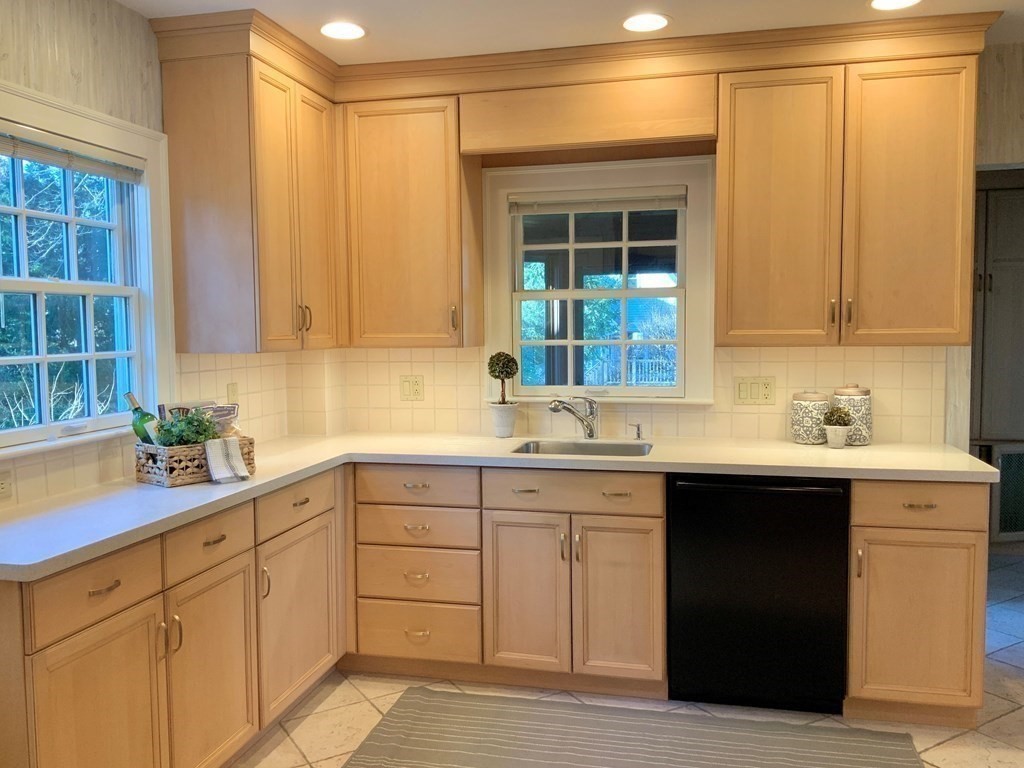 31 Grandview Road Arlington, MA 02476 - Photo 9 of 22 a kitchen with sink cabinets and potted plant