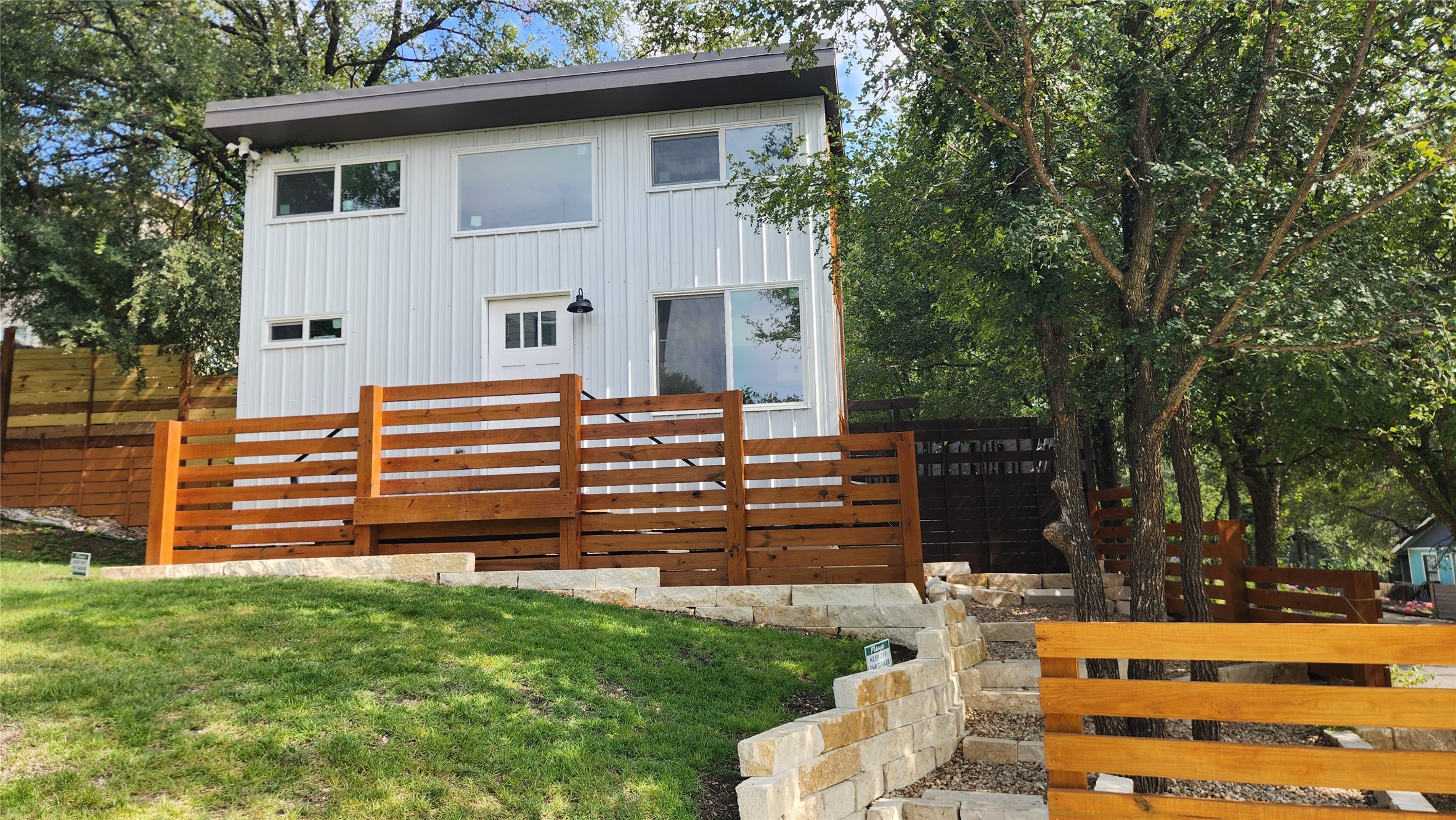 1134 Lott Avenue Austin, TX 78721 - Photo 24 of 33 a backyard of a house with wooden fence and a bench