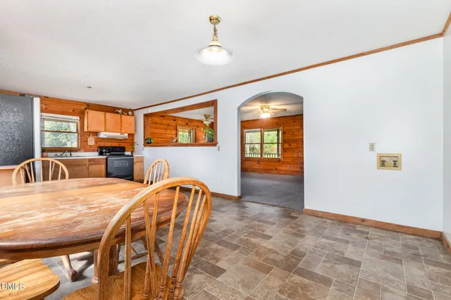 a view of a dining room with furniture and window
