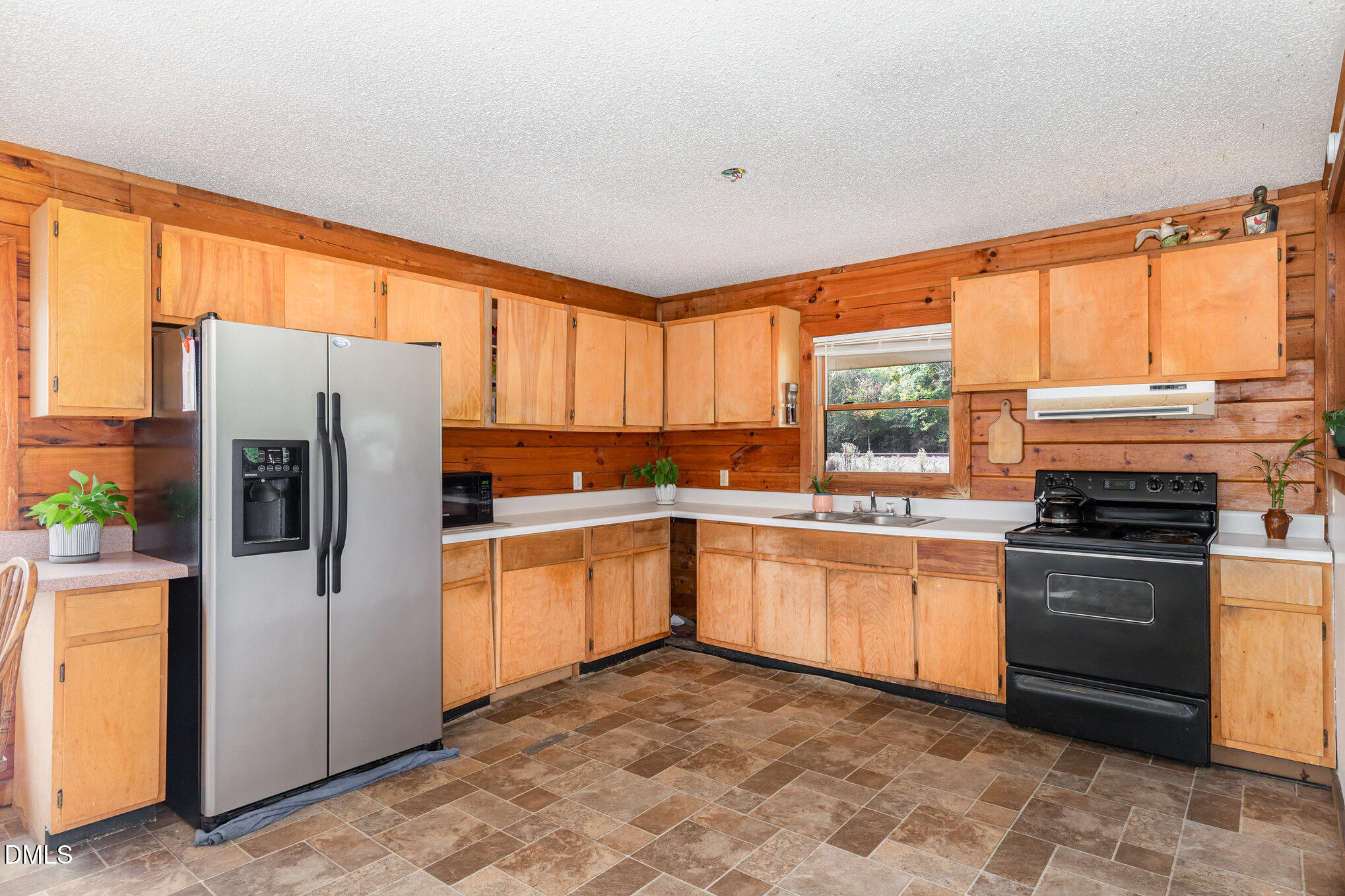 3018 University Station Road Durham, NC 27705 - Photo 14 of 32 a kitchen with stainless steel appliances granite countertop a refrigerator sink and stove
