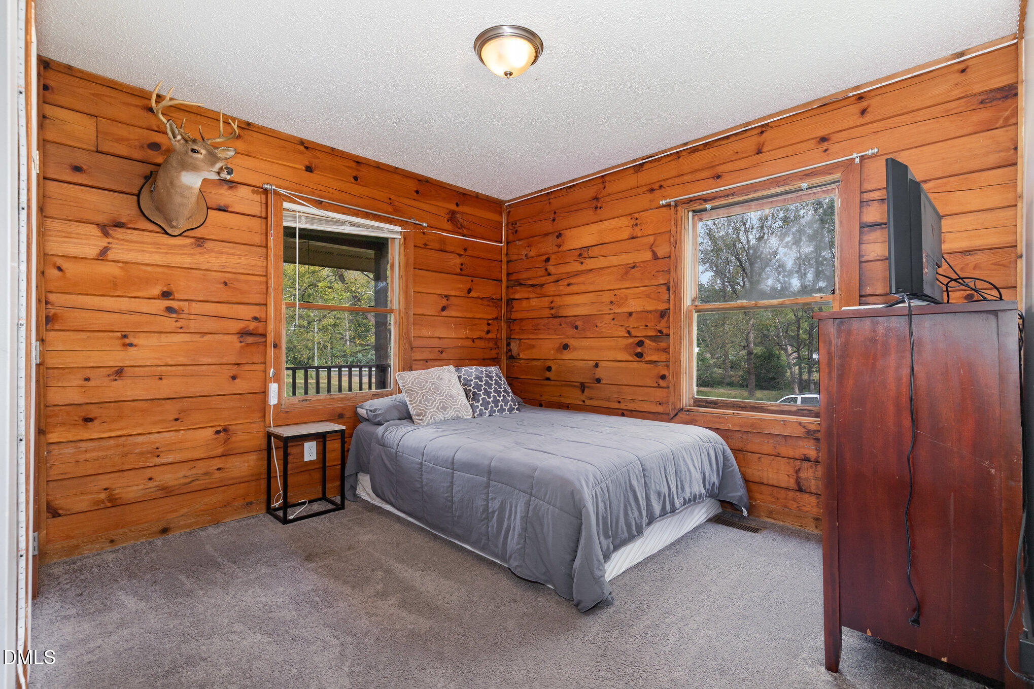 3018 University Station Road Durham, NC 27705 - Photo 19 of 32 a bedroom with a bed and a window