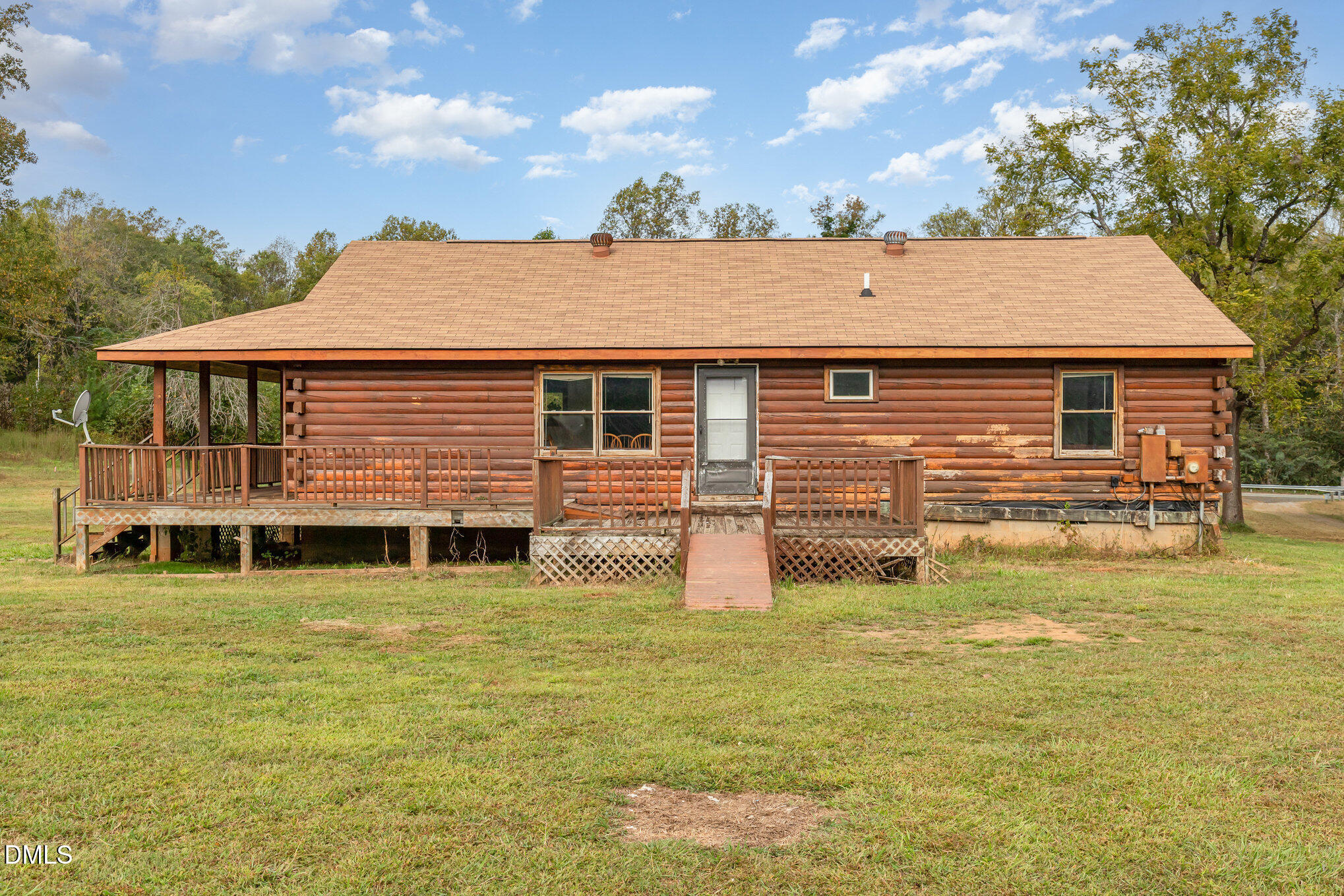 3018 University Station Road Durham, NC 27705 - Photo 26 of 32 a front view of a house with a yard