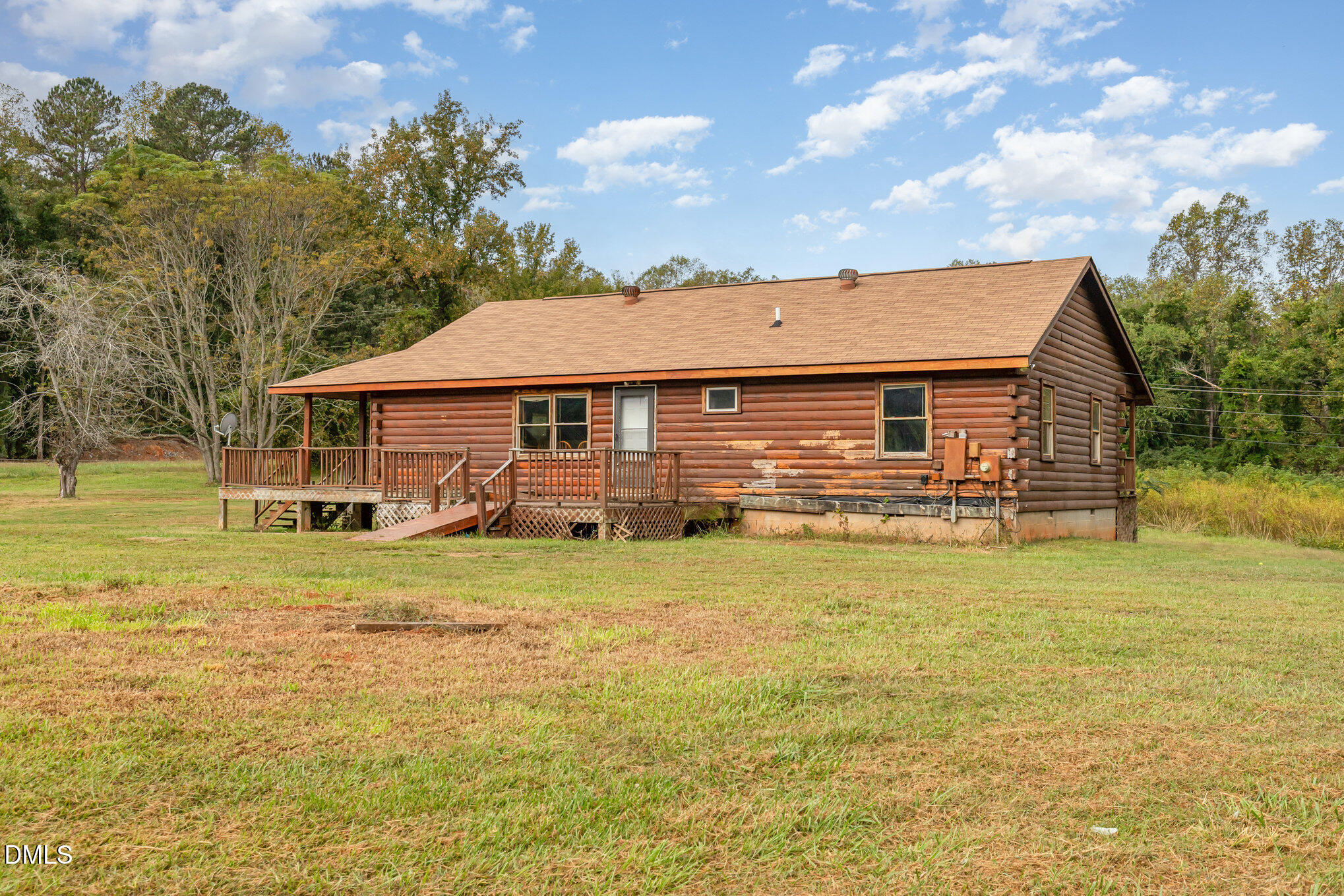 3018 University Station Road Durham, NC 27705 - Photo 27 of 32 a front view of a house with a garden