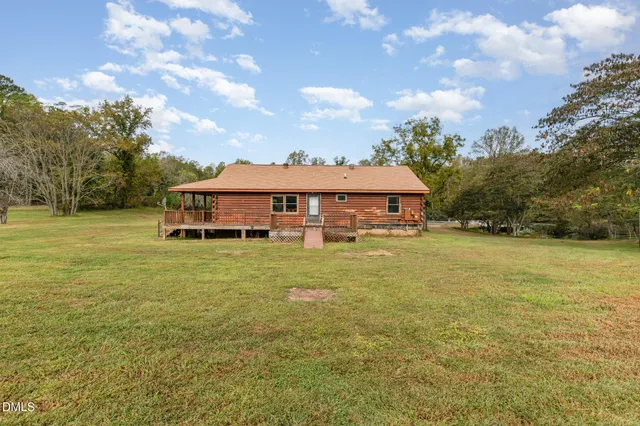 a front view of house with yard and seating