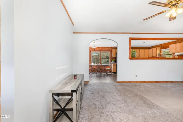 a view of room with window and wooden floor