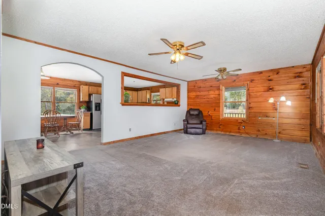 a view of room with workspace and windows