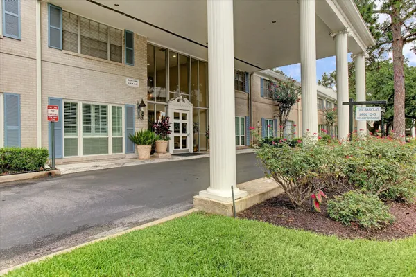 front view of a building with a yard