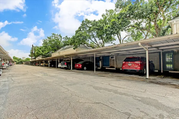 a view of a car parked in front of a building