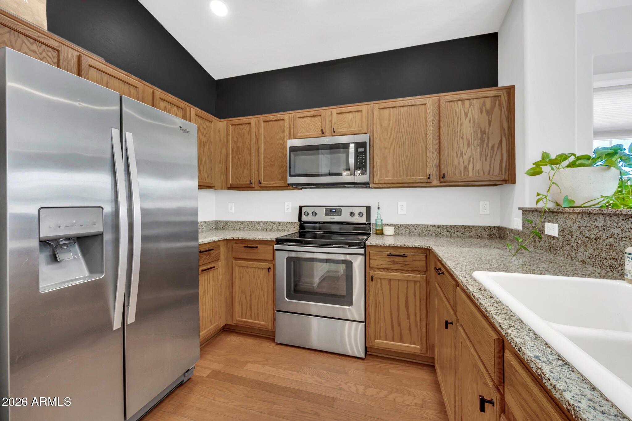5627 South 21st Terrace Phoenix, AZ 85040 - Photo 14 of 32 a kitchen with a refrigerator sink and microwave