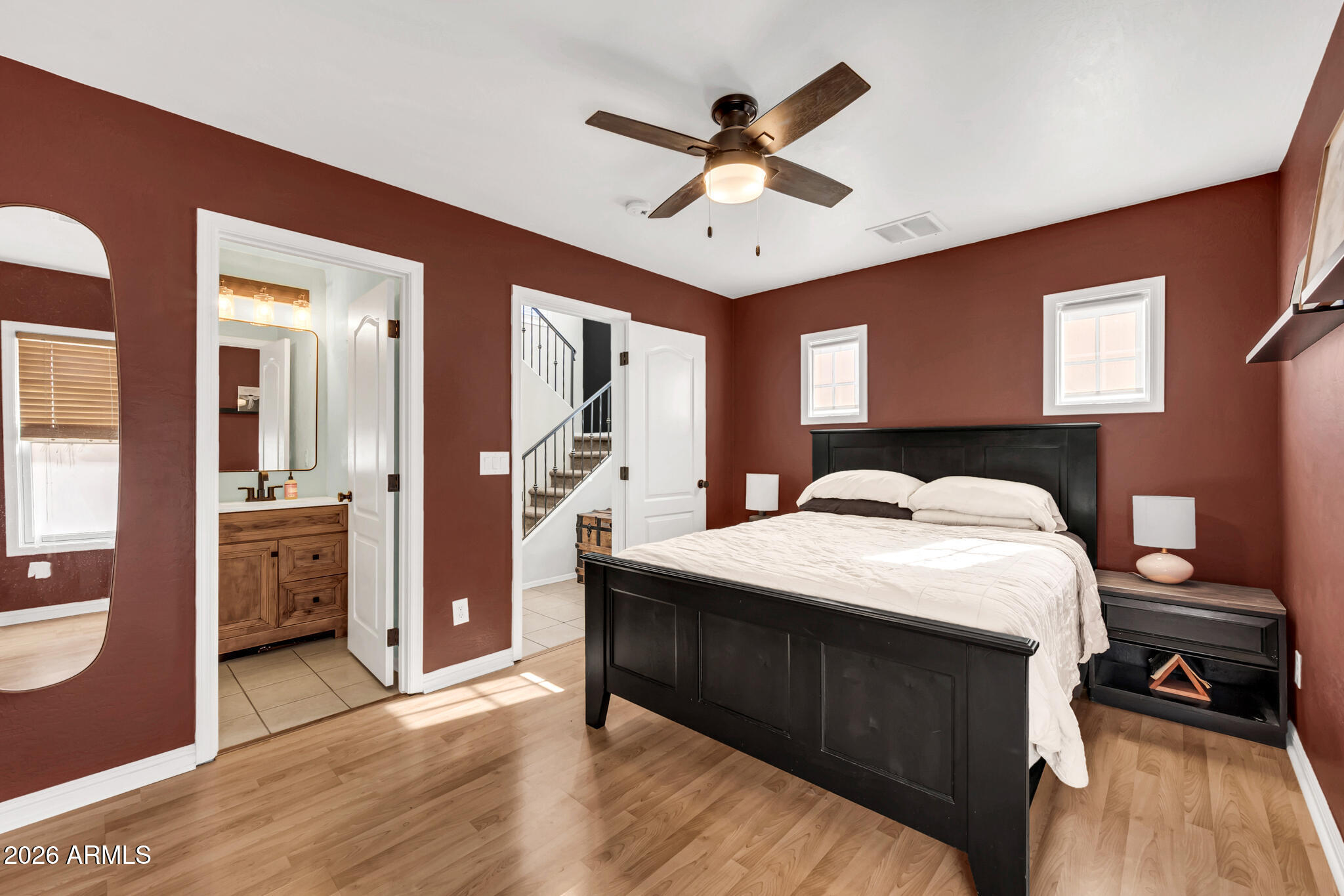 5627 South 21st Terrace Phoenix, AZ 85040 - Photo 17 of 32 a bedroom with a bed and a chandelier