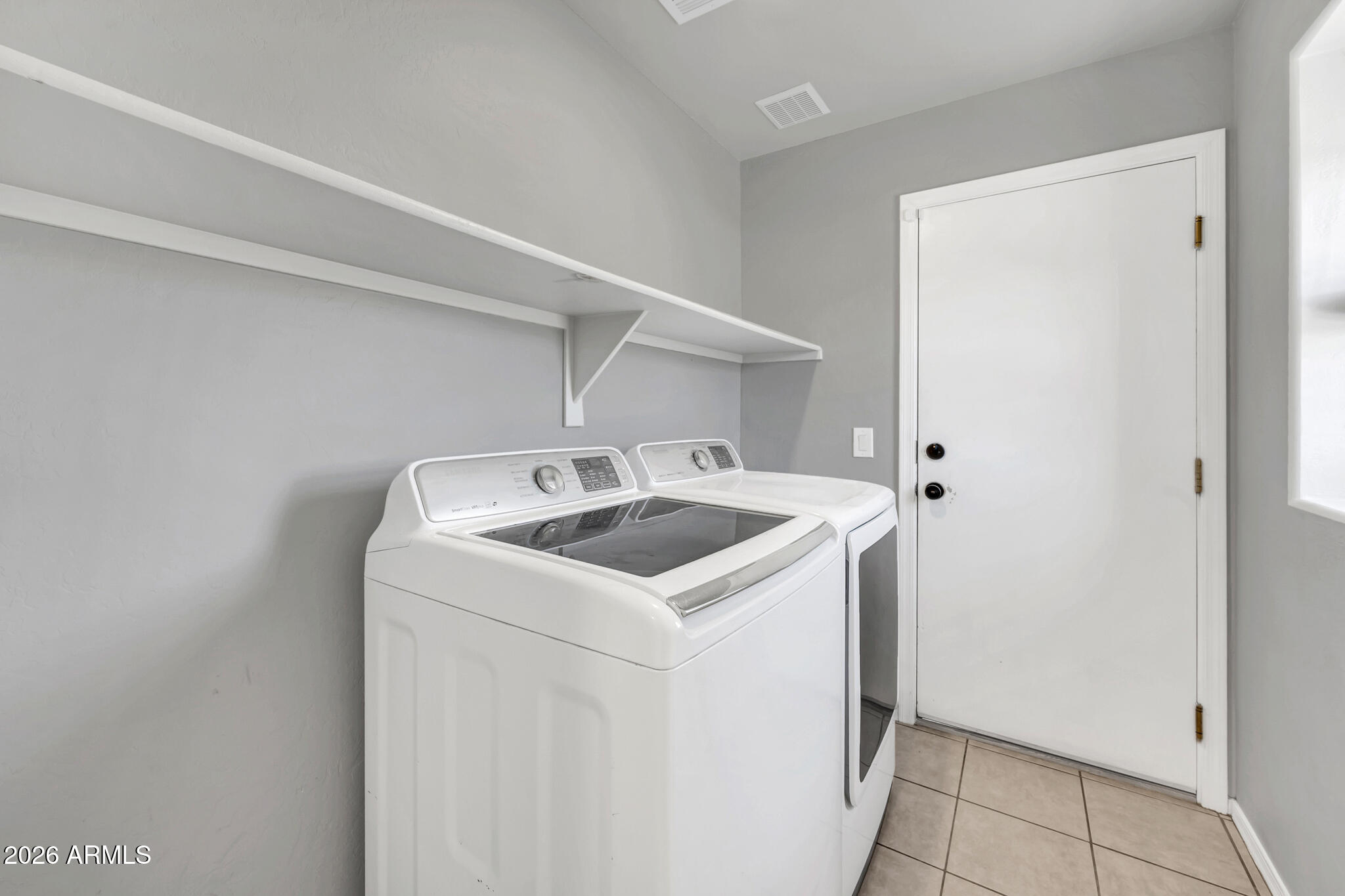 5627 South 21st Terrace Phoenix, AZ 85040 - Photo 24 of 32 a utility room with dryer and washer