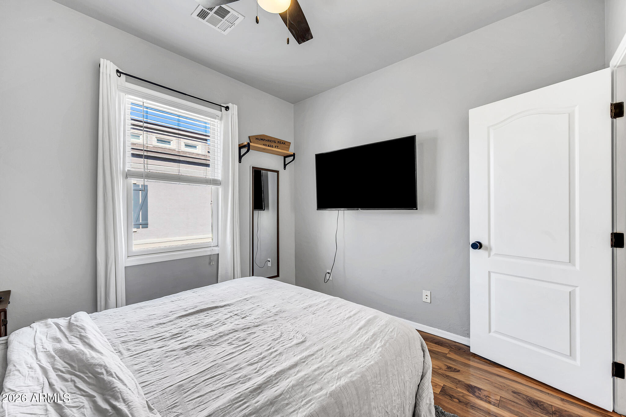 5627 South 21st Terrace Phoenix, AZ 85040 - Photo 26 of 32 a bedroom with a bed and a flat screen tv