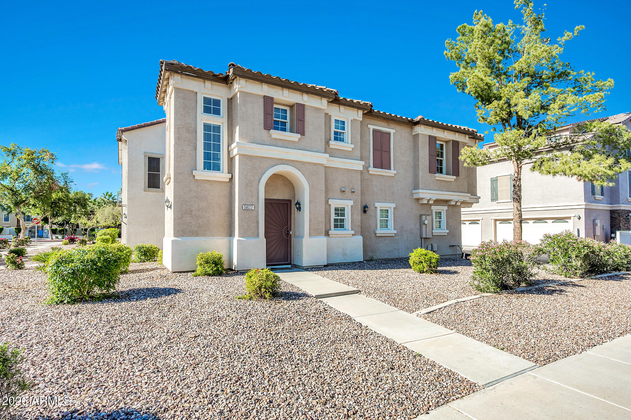 5627 South 21st Terrace Phoenix, AZ 85040 - Photo 2 of 32 a front view of a house with a yard