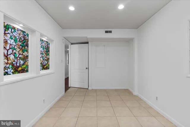 a view of room with window and hallway