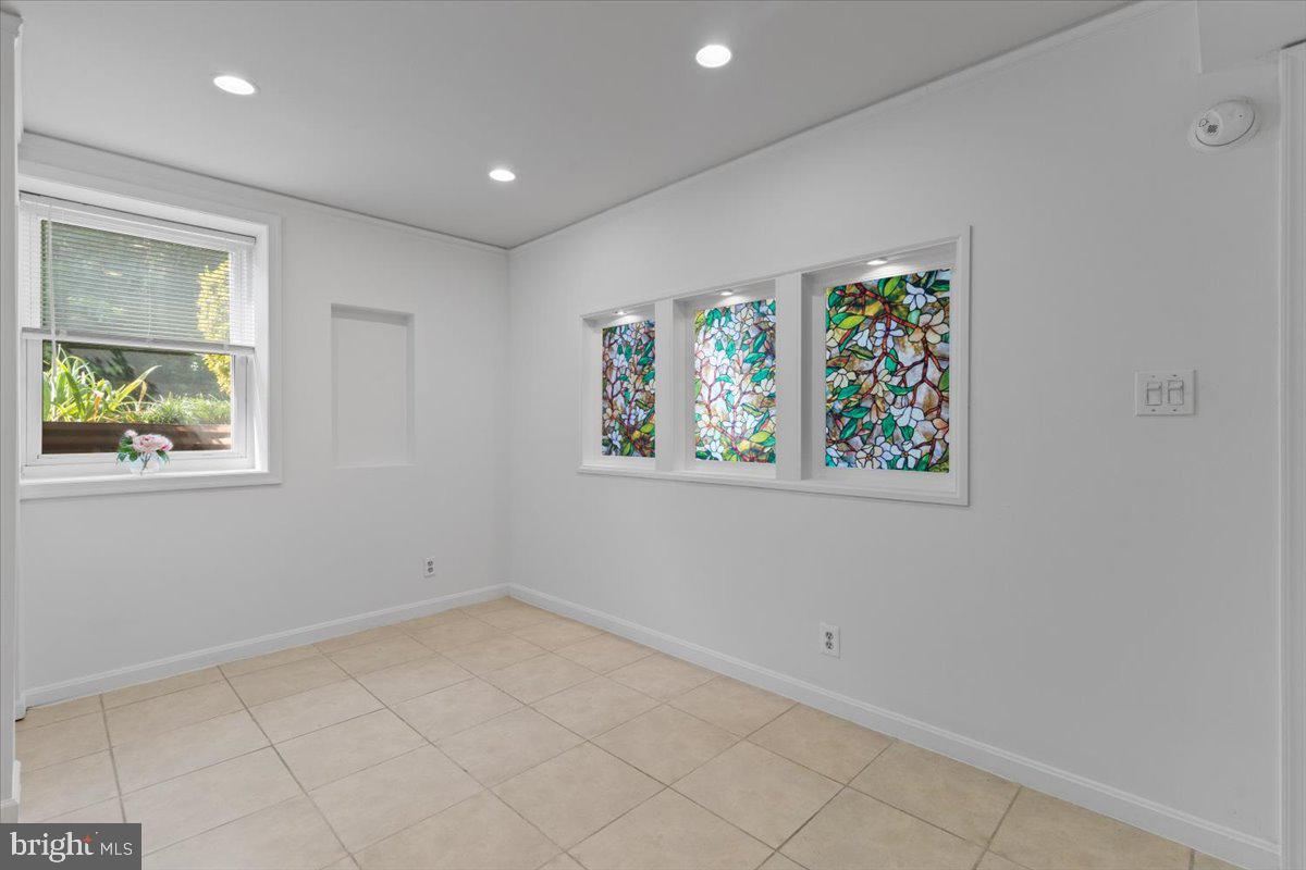 202 Buckingham Lane, Unit 102 Stafford, VA 22556 - Photo 29 of 37 an empty room with windows