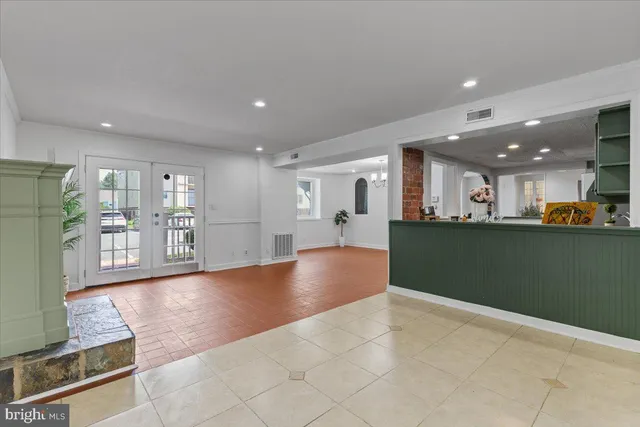 a view of a kitchen with refrigerator and a counter top