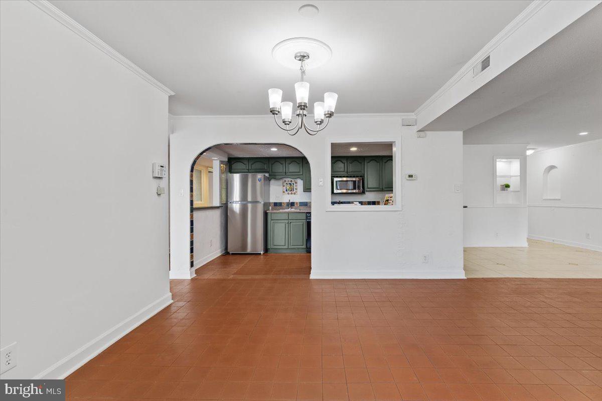 202 Buckingham Lane, Unit 102 Stafford, VA 22556 - Photo 10 of 37 a view of a hallway with a chandelier