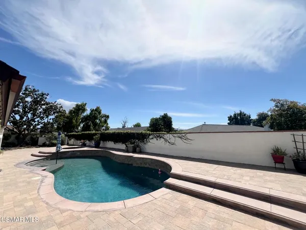 a view of a swimming pool with a patio