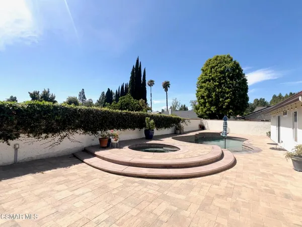 a view of swimming pool with a yard and seating