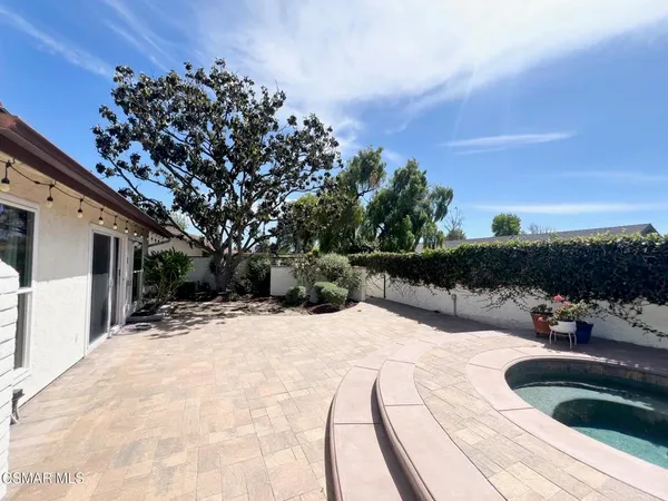 a view of a back yard of the house