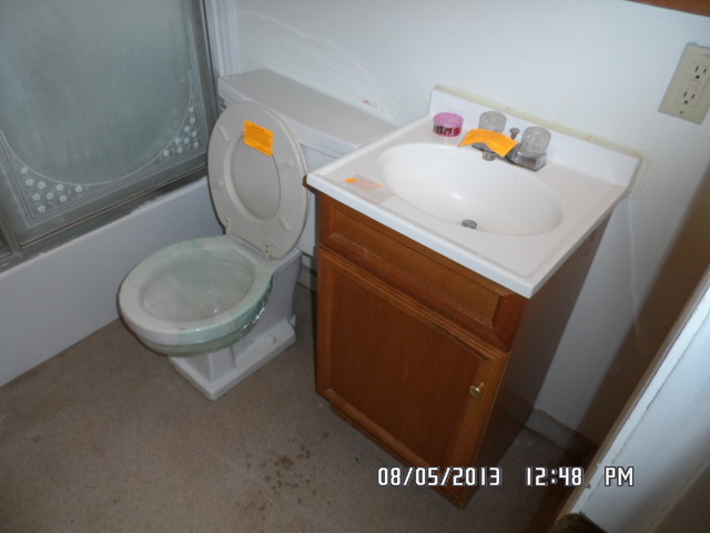 402 Garland Avenue Romeoville, IL 60446 - Photo 11 of 12 a bathroom with a sink and a mirror