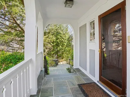 a view of a porch of a house