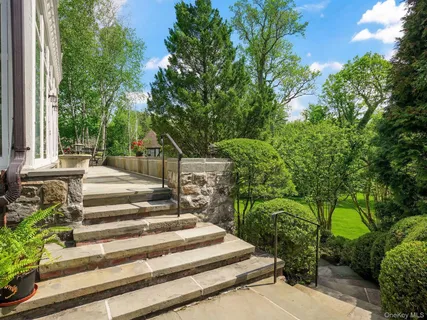 a outdoor dining space with furniture and wooden floor