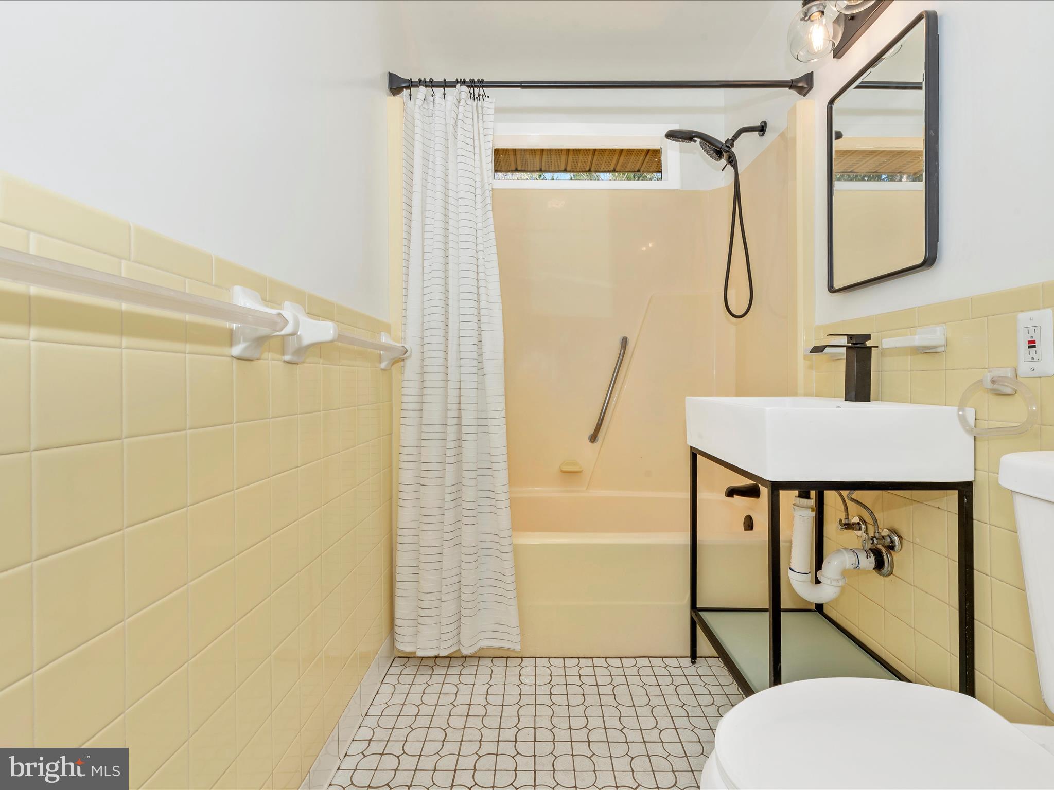 15224 Ganley Road Boyds, MD 20841 - Photo 26 of 62 a bathroom with a sink toilet and shower