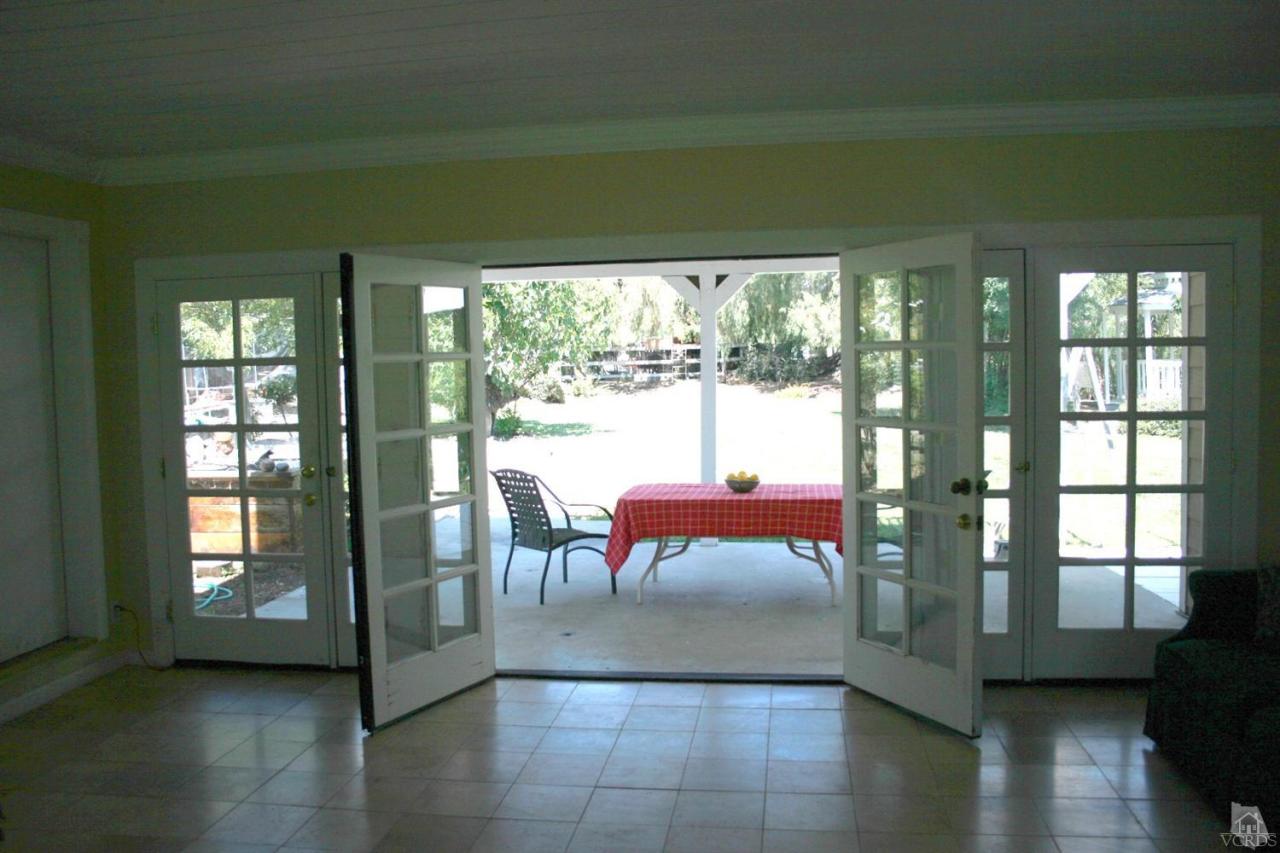 806 Rancho Road Thousand Oaks, CA 91362 - Photo 3 of 27 a living room filled with furniture and a floor to ceiling window