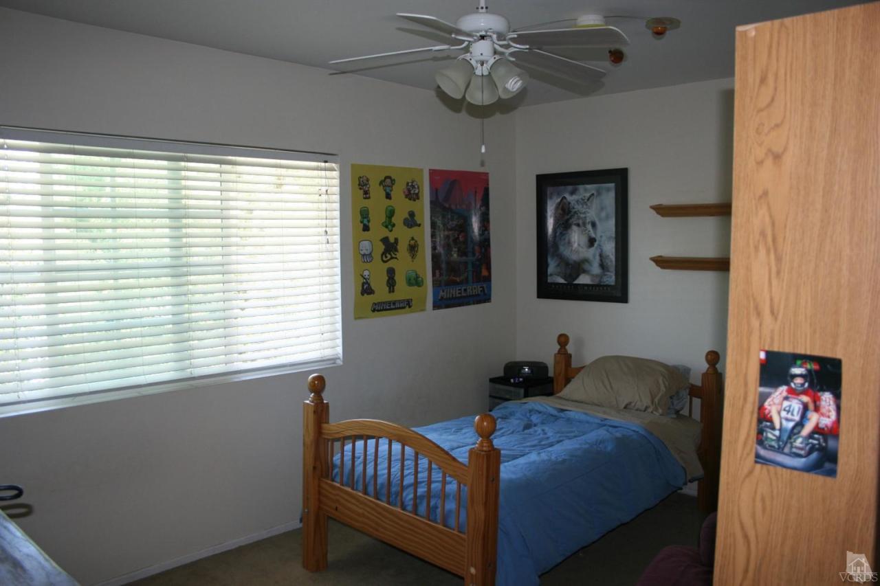 806 Rancho Road Thousand Oaks, CA 91362 - Photo 22 of 27 a bedroom with a bed and a window