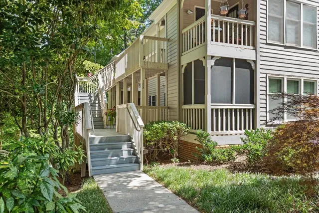 a view of a house with brick walls