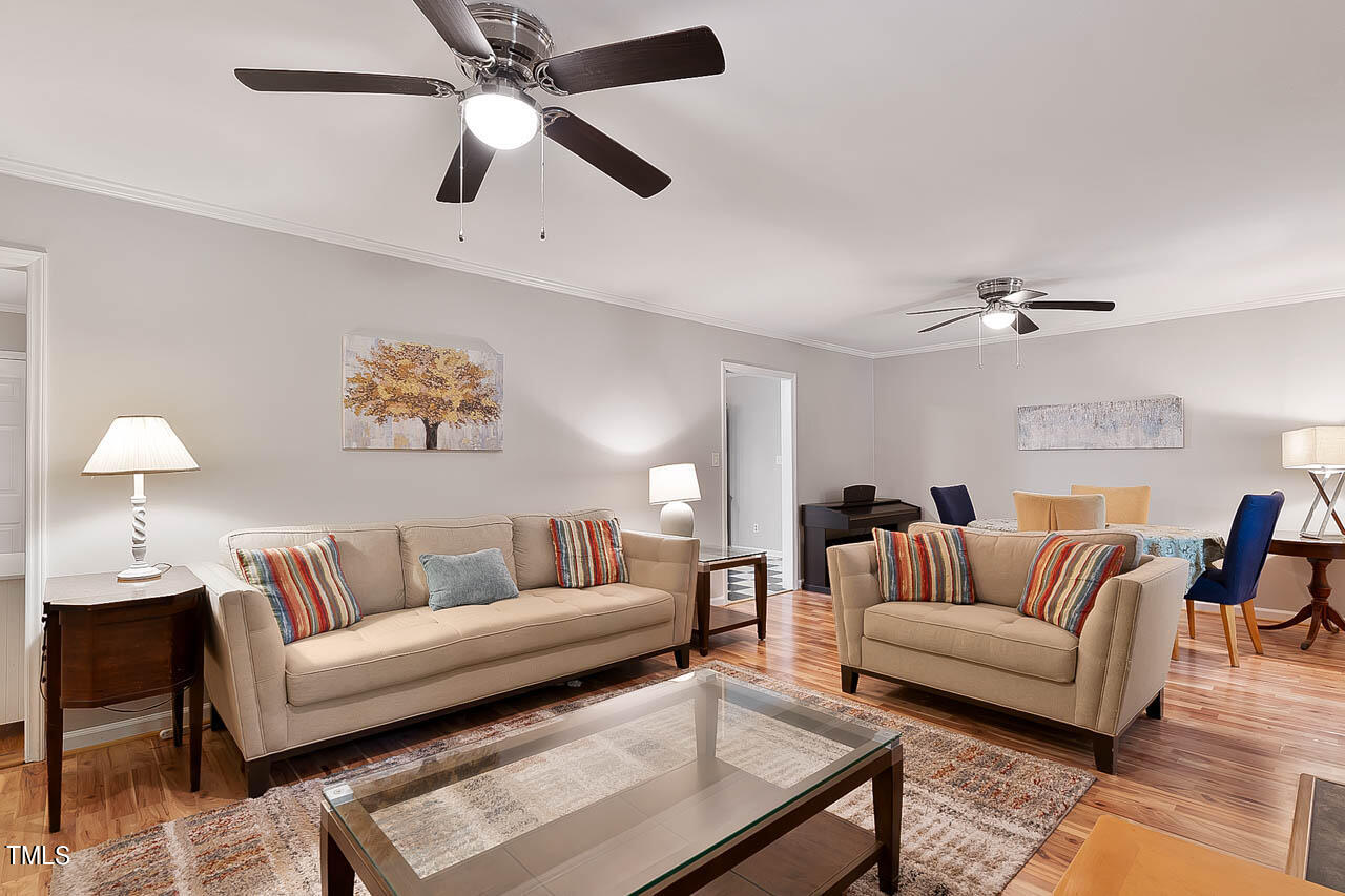 5525 Middleton Road Durham, NC 27713 - Photo 15 of 38 a living room with furniture and a ceiling fan