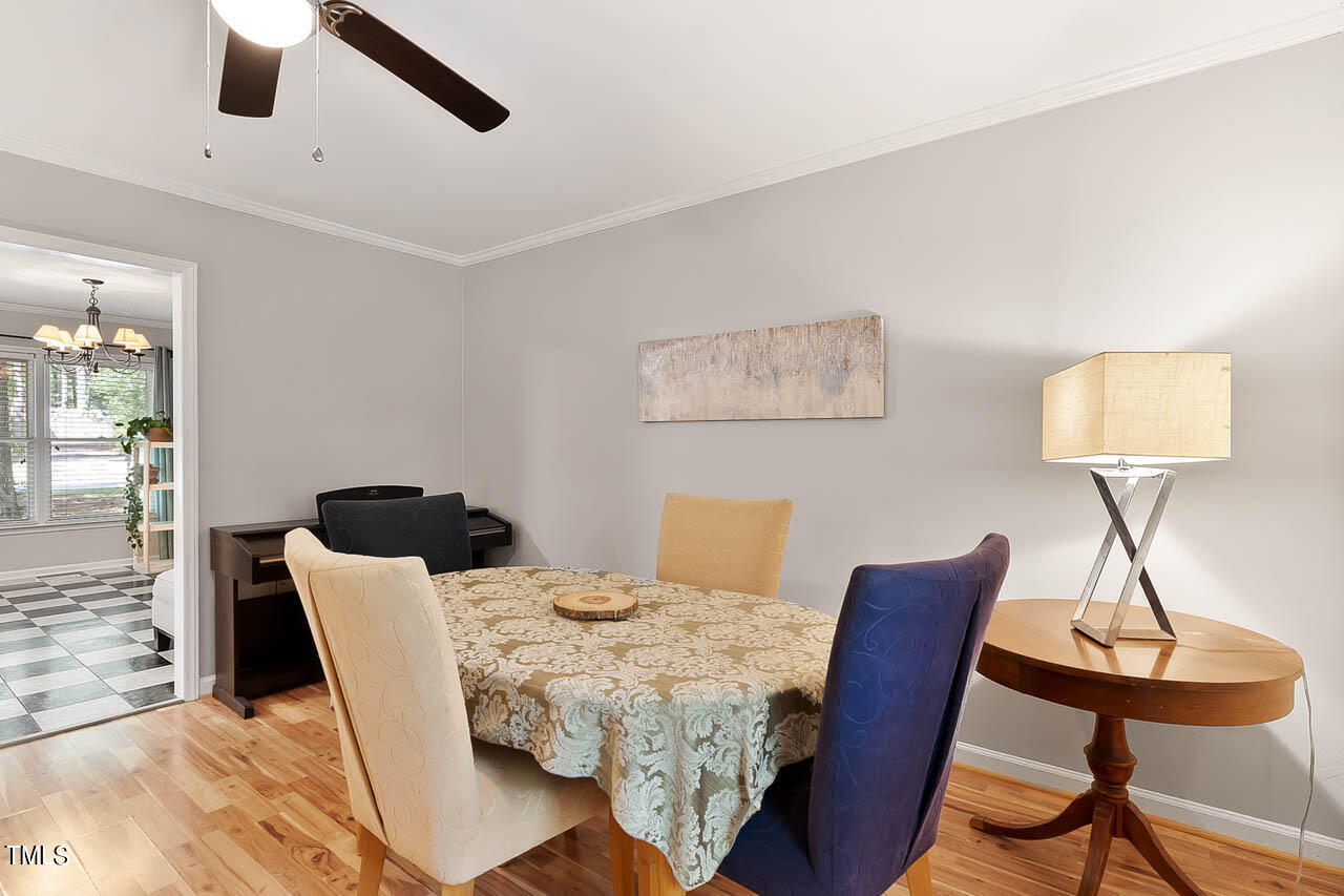 5525 Middleton Road Durham, NC 27713 - Photo 18 of 38 a view of a dining room with furniture and wooden floor