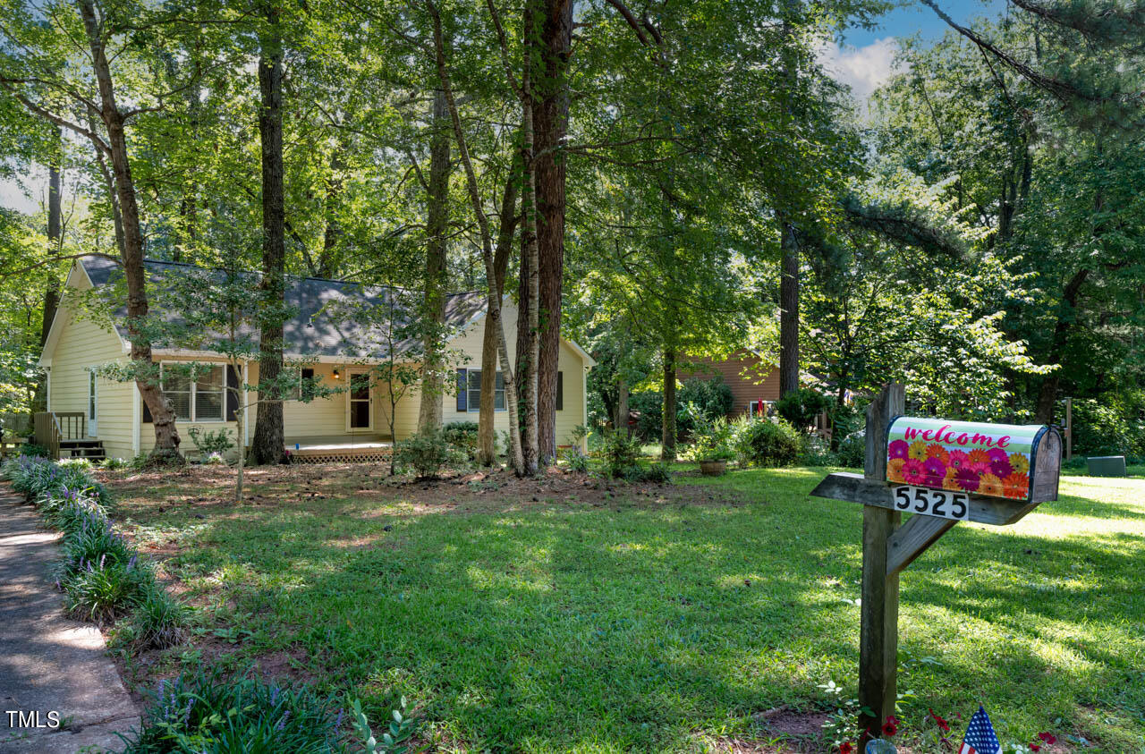 5525 Middleton Road Durham, NC 27713 - Photo 2 of 38 a view of a house with backyard and a tree