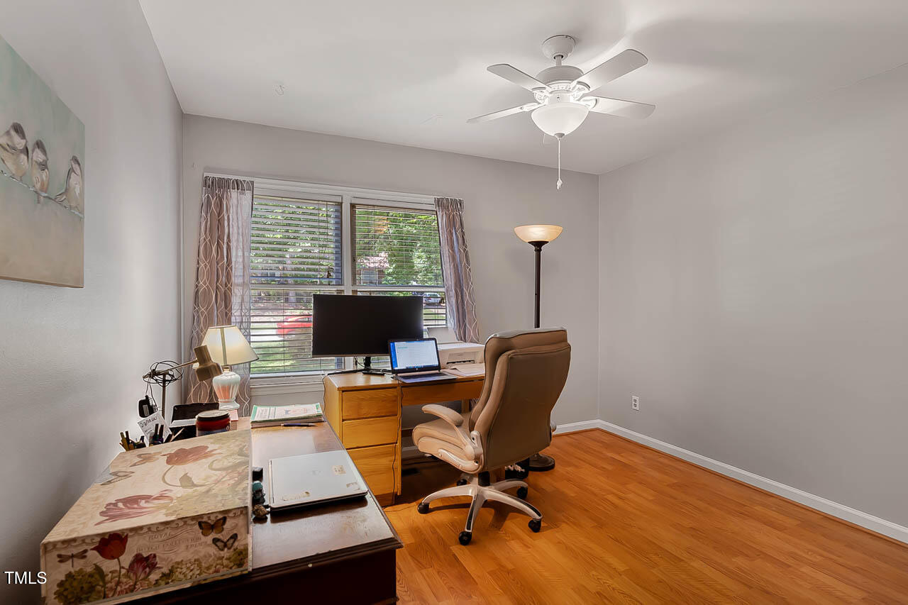5525 Middleton Road Durham, NC 27713 - Photo 30 of 38 a view of a workspace with furniture and a window