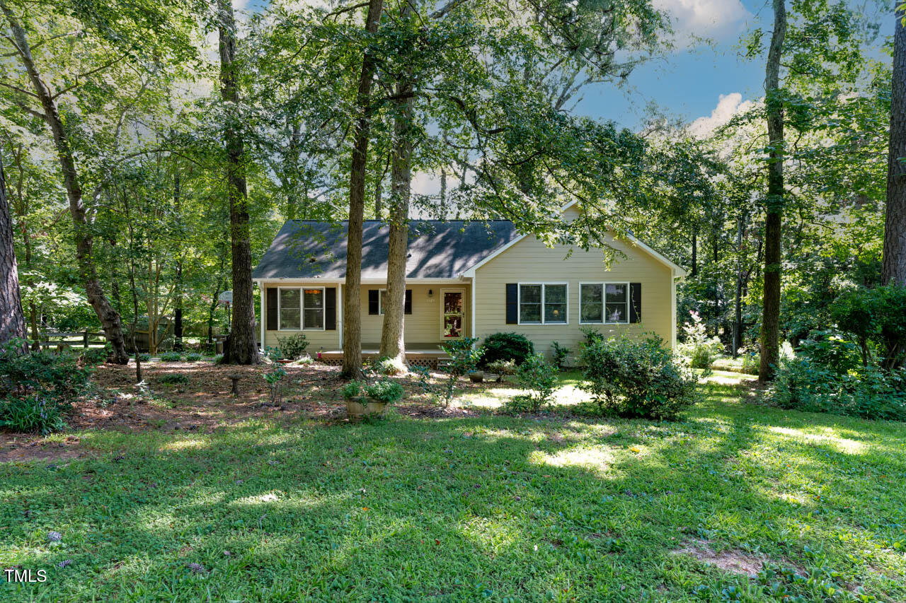 5525 Middleton Road Durham, NC 27713 - Photo 3 of 38 a front view of a house with a yard and trees