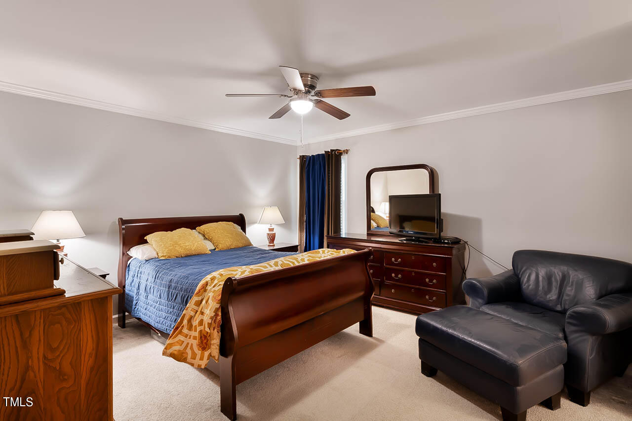 5525 Middleton Road Durham, NC 27713 - Photo 31 of 38 a bedroom with a bed couch and dresser