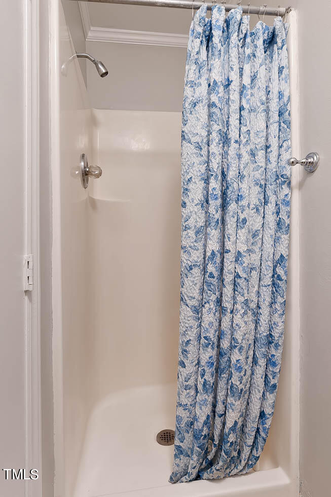 5525 Middleton Road Durham, NC 27713 - Photo 34 of 38 a bathroom with a shower curtain