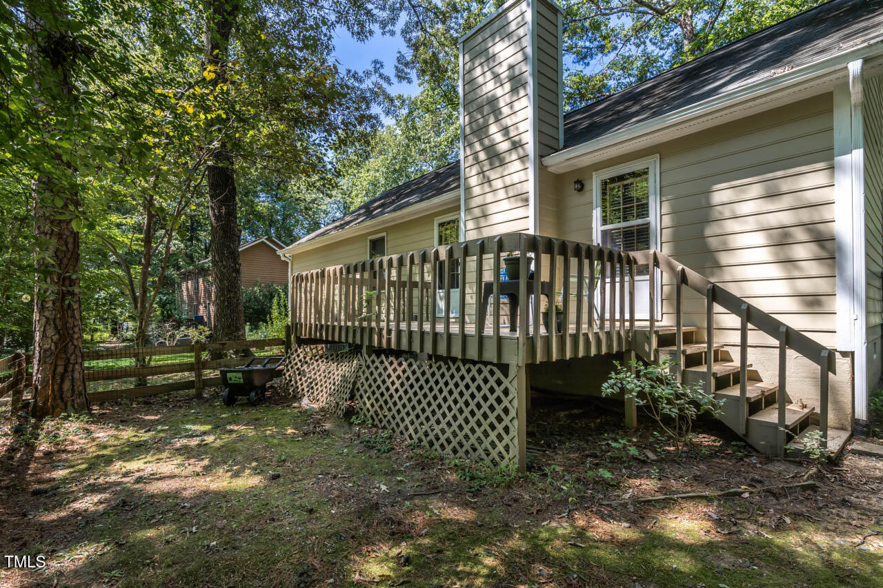 5525 Middleton Road Durham, NC 27713 - Photo 10 of 38 a view of a house with a small yard and wooden fence